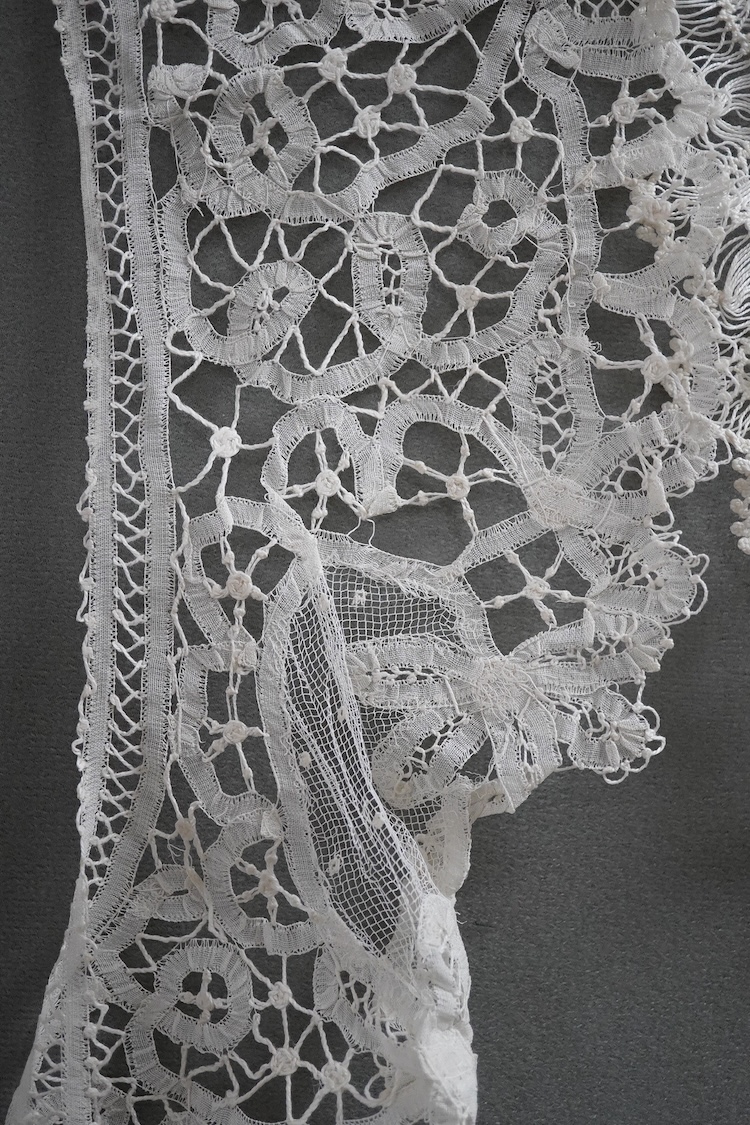 A collection of crochet and bobbin lace trimmings and a small collection of Honiton collars etc